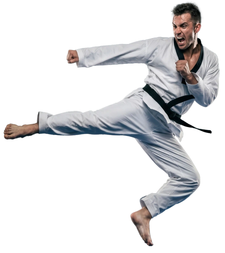 Taekwondo students practicing martial arts techniques inside a training hall