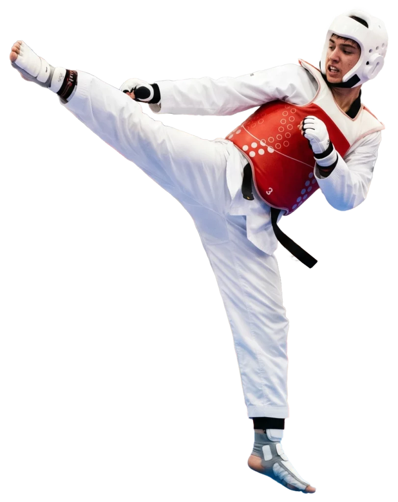 Students practicing Taekwondo techniques together during a martial arts class.